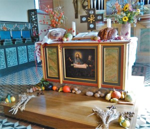 The altar bedecked with vegetables and flowers